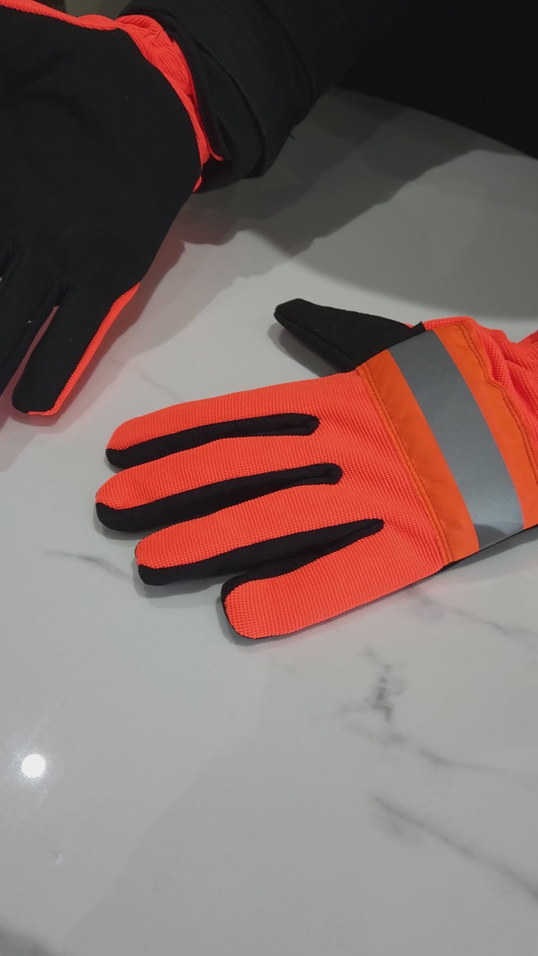 Reflective safety gloves designed for enhanced visibility in low-light conditions, featuring reflective materials for increased wearer conspicuity. Ideal for use in construction, roadwork, and other settings where visibility is crucial for safety